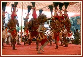 Tribal devotees perform a traditional dance