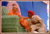 Swamishri blesses the satsangi tribal volunteer