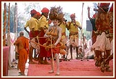 Tribal devotees perform a traditional dance