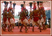 Tribal devotees perform a traditional dance