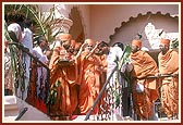 From the mandir porch Swamishri looks afar at the Swaminarayan mandir in the nearby village of Shirdane