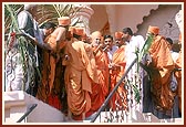 From the mandir porch Swamishri looks afar at the Swaminarayan mandir in the nearby village of Shirdane