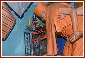 Swamishri does pujan of Thakorji in the ghar-mandir in a house sanctified by Shastriji Maharaj