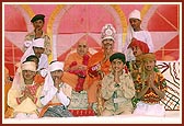 Swamishri with the balaks after their drama performance 