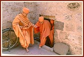 From the mandir Swamishri enters an adjacent house that had been sanctified by Shastriji Maharaj