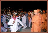 Swamishri pleases the devotees by participating in singing and playing of cymbals