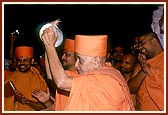 Swamishri pleases the devotees by participating in singing and playing of cymbals