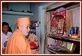 Swamishri during the home-visit at Harkorbai's home, a leading devotee 