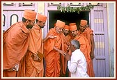 Meeting a devotee by the front door of Pujya Purushottamdasji's home