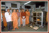 Swamishri inaugurates a chapati-making machine in the mandir