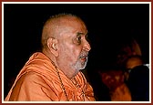 Swamishri engrossed in rocking Thakorji's cradle