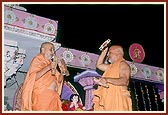 Swamishri and Pujya Ghanshyamcharan Swami dance with kartals