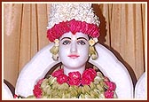 Shri Ghanshyam Maharaj (Shri Dharmakul) bedecked with flowers