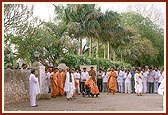 Swamishri coming out of the Smruti Mandir