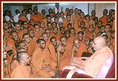  Swamishri converses with sadhus from Sarangpur