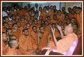  Swamishri converses with sadhus from Sarangpur