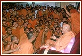  Swamishri converses with sadhus from Sarangpur