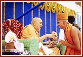  Swamishri gives the guru mantra during the diksha rituals