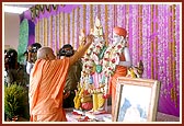 Swamishri performs the murti-pratishtha rituals of Shri Akshar Purushottam Maharaj and Guru Parampara for the hari mandir in Traj village