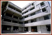 Swamishri on an observation tour of the under-construction 'Pramukh Swami Hospital' by the BAPS