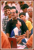 A devotee participates in the yagna