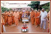 Swamishri and sadhus perform pradakshina of the mandir during the festival 