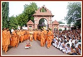 Swamishri and sadhus perform pradakshina of the mandir during the festival 