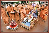 During Rath Yatra festival Swamishri performs pujan of Shri Harikrishna Maharaj on the mandir grounds in Amdavad