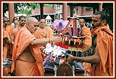 During Rath Yatra festival Swamishri performs pujan of Shri Harikrishna Maharaj on the mandir grounds in Amdavad