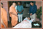 Swamishri blesses an ailing devotee