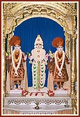 Bhagwan Swaminarayan decked in flowers with Aksharbrahma Gunatitanand Swami and Shri Gopalanand Swami