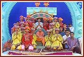 Kishores with Swamishri after performing a traditional dance