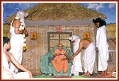 Swamishri lights an inaugural lamp and is welcomed by youths dressed as Bhrugu Rishi and other sages after his arrival
