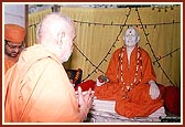 Swamishri engaged in darshan of Shastriji Maharaj at the birthplace, Mahelav