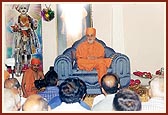 Addresses the satsang assembly in mandir