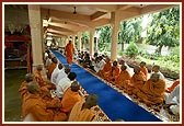 Sadhus sing bhajans during Swamishri's morning walk