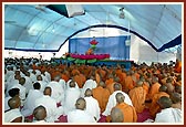 Sadhus and devotees during the morning puja