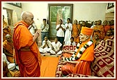 Swamishri engaged in darshan in the sacred room of Shastriji Maharaj