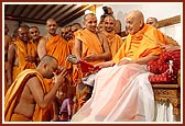 Swamishri personally serves dudhpak to sadhus on the occasion of Shastriji Maharaj's shraddh