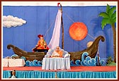Swamishri performs morning puja on Jal Jhilani Festival with a boat in the backdrop