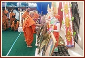 Swamishri performs murti-pratishtha rituals of murtis for hari mandirs in Gunatitanagar (Modhpar), Yagnapurushnagar (Gariya) and Gariya (old village) that were reconstructed by BAPS after the earthquake