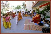 Students perform a welcome dance before Swamishri