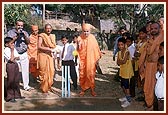Swamishri participates with the students while they play