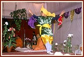 A Sikh boy performs Bhangda during the bhajan