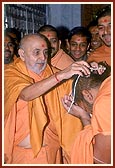 ... and finally blesses a sadhu 