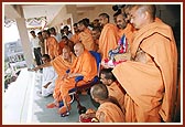 Swamishri is being informed about the ongoing construction