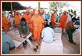Swamishri showers his blessings and observes the work done by craftsmen at the BAPS workshop in Manpur