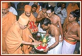 Swamishri is traditionally welcomed with an auspicious purna-kumbh