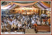 Devotees listening to the discourse