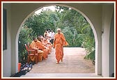Sadhus sing bhajans during Swamishri's evening walk